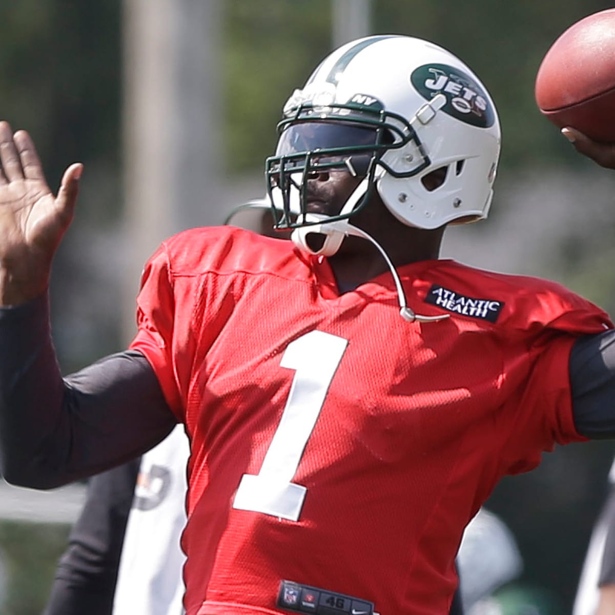 Jets quarterback Michael Vick patted a reporter on the butt after