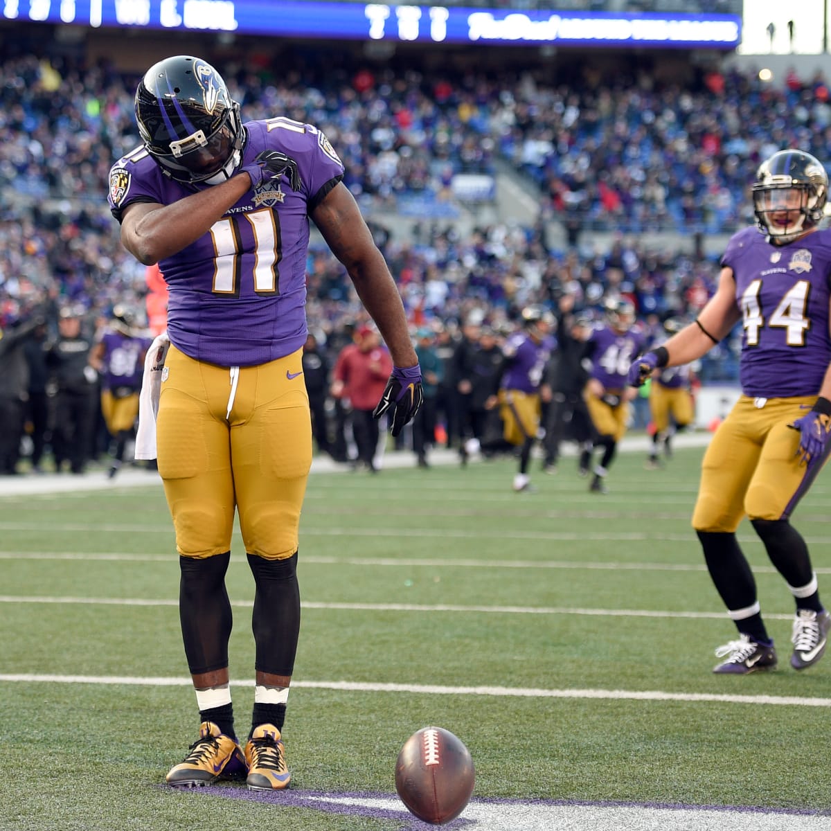 Baltimore Ravens wide receiver Kamar Aiken (11) celebrates with teammates  after scoring a 2-yard touchdown against the Cleveland Browns at M&T Bank  Stadium in Baltimore, Maryland on December 28, 2014. The Ravens