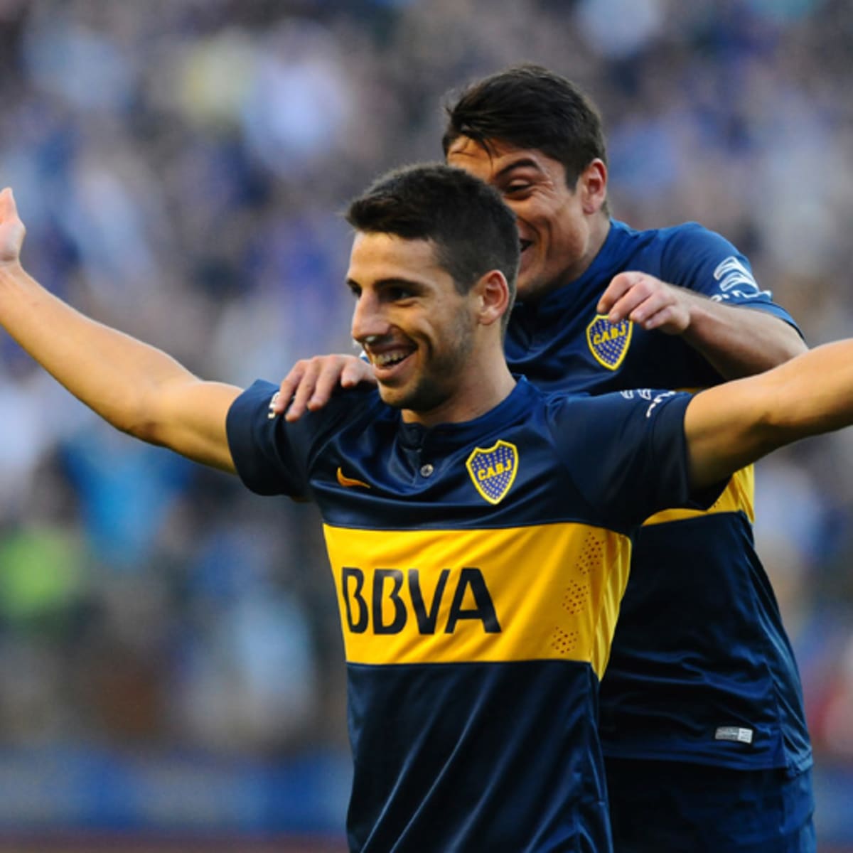 Jonathan Calleri of Boca Juniors, center, heads the ball during a