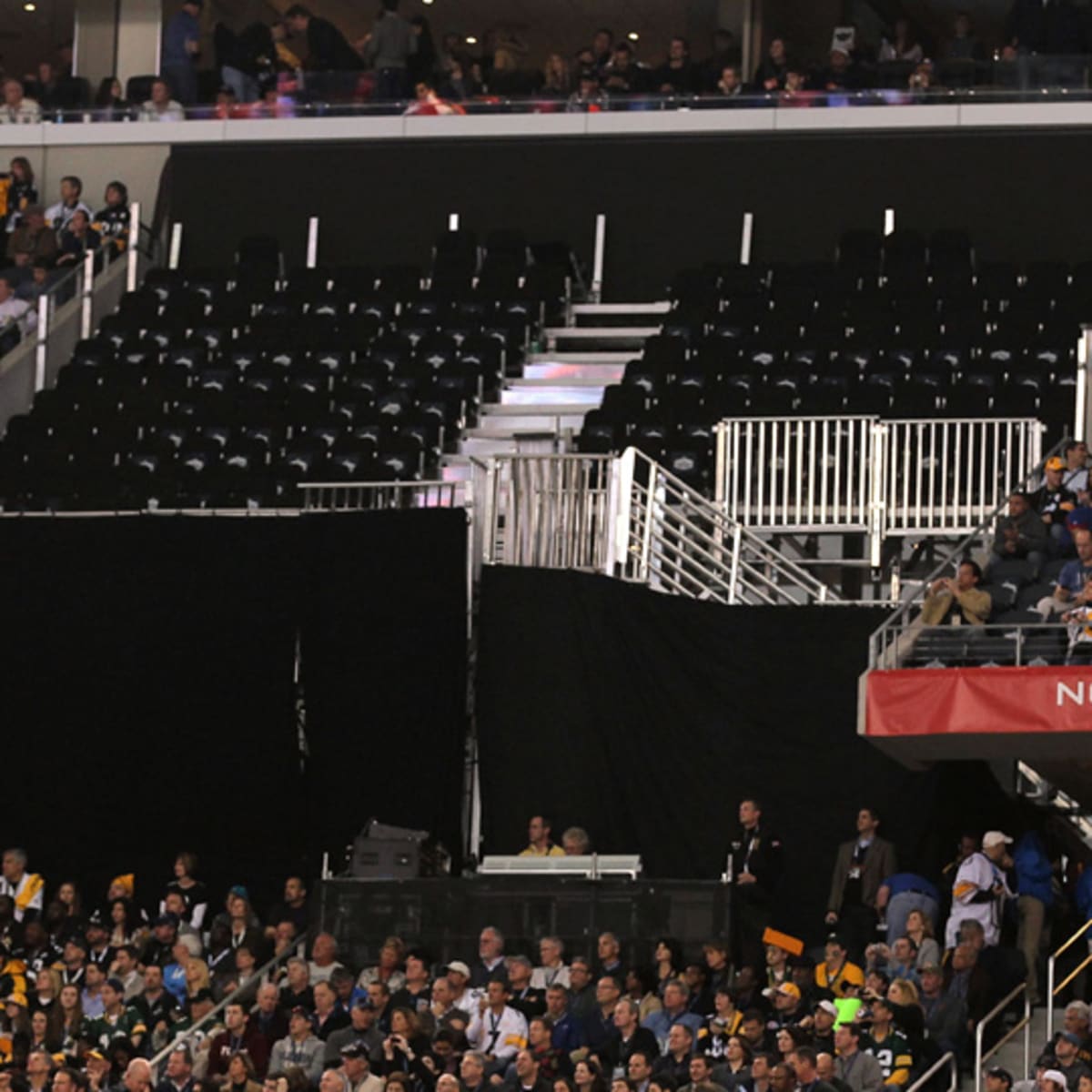 Empty seats are seen during Super Bowl XLV at Cowboys Stadium in