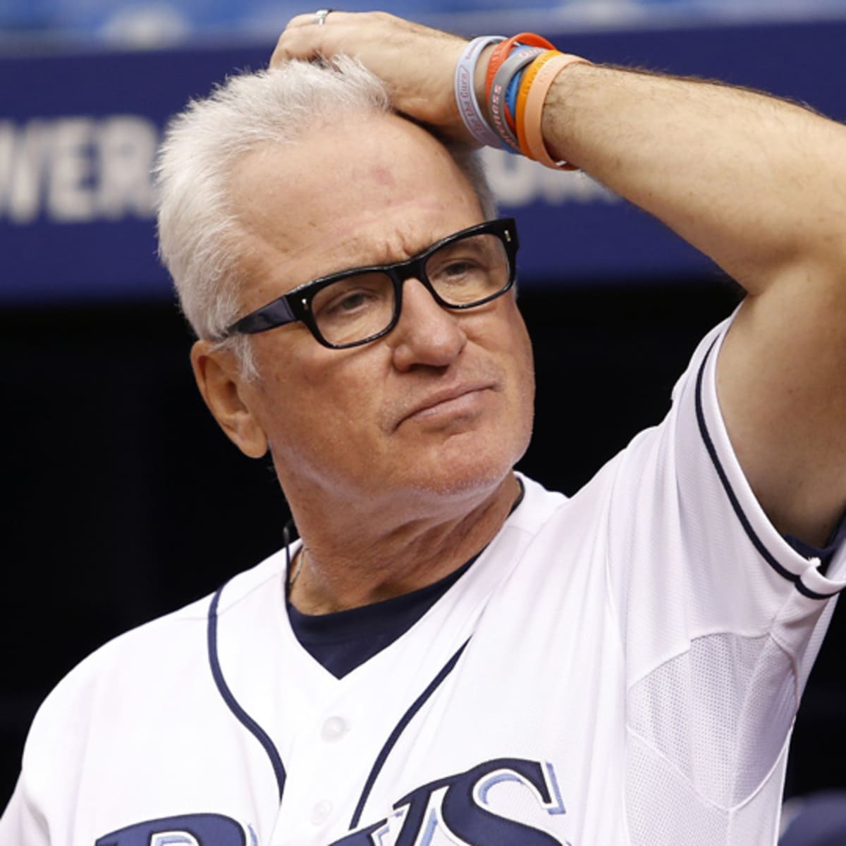 Tampa Bay Rays Manager Joe Maddon leaves the field after the Rays defeated  the Boston Red Sox 3-1 to win the American League Championship at Tropicana  Field in St. Petersburg, Florida on