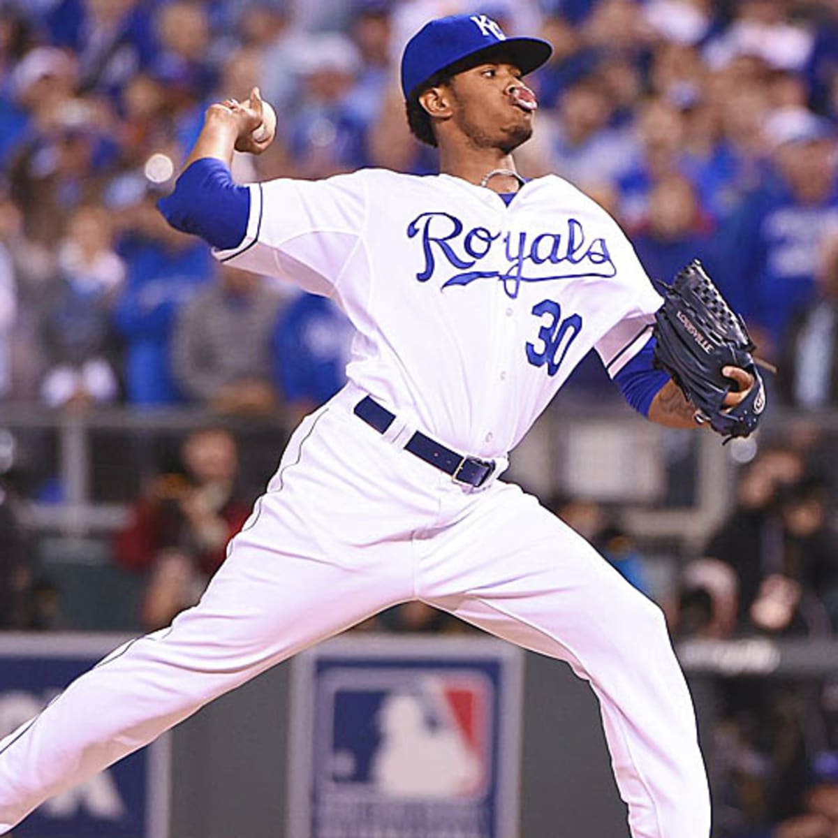 Kansas City Royals catcher Salvador Perez talks with reliever Wade Davis  with one San Francisco Giants runner on second during the eighth inning of game  7 of the World Series at Kauffman