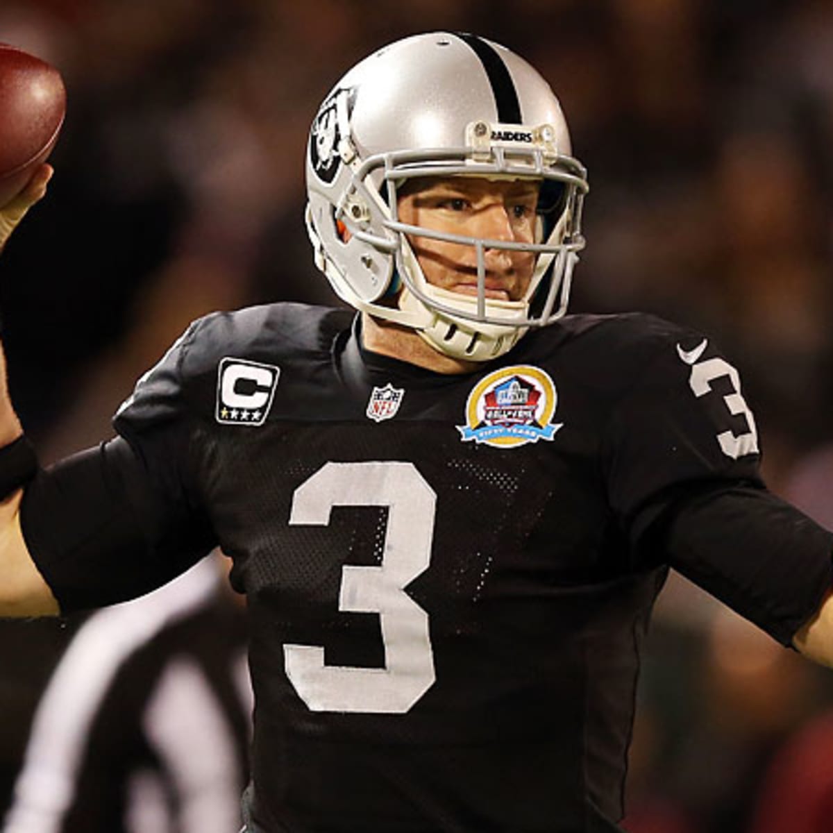 Oakland Raiders' Carson Palmer (3) warms up prior to a preseason