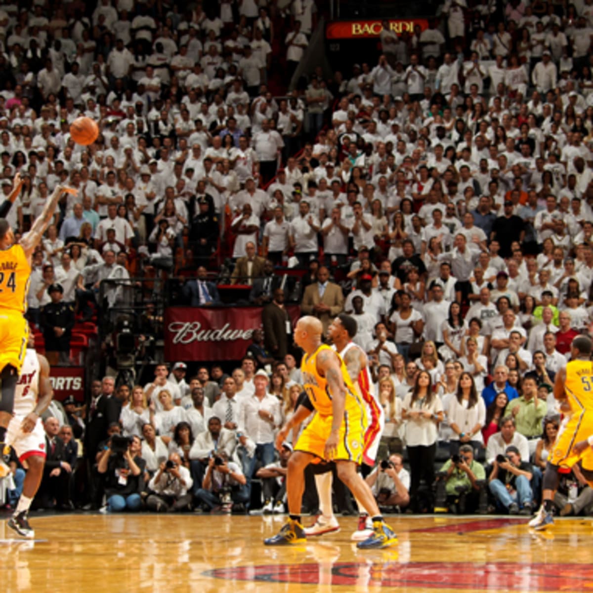 Indiana Pacers' Paul George (24) reacts after fouling in the second half of  an NBA basketball game against the Miami Heat, Wednesday, Dec. 18, 2013, in  Miami. The Heat defeated the Pacers