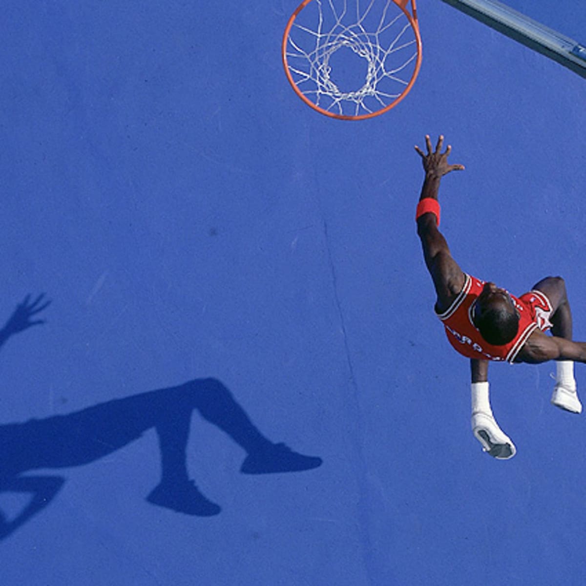 Download Michael Jordan in midair during a gravity-defying dunk