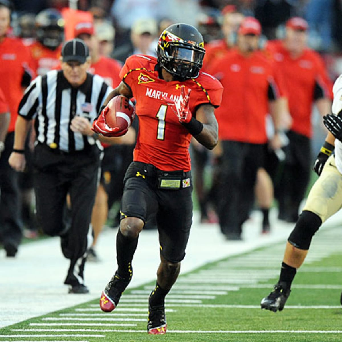 Maryland wide receiver Stefon Diggs (1) runs with the ball during the first  half of an NCAA college football game against North Carolina State,  Saturday, Oct. 20, 2012, in College Park, Md. (