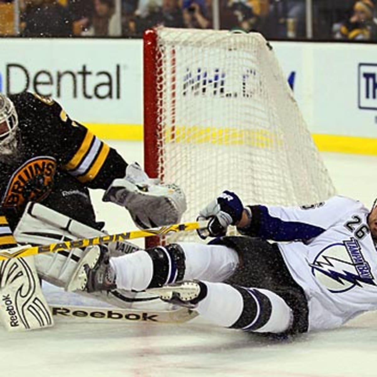 Tampa Bay Lightning's Martin St. Louis, center, and Pavel Kubina