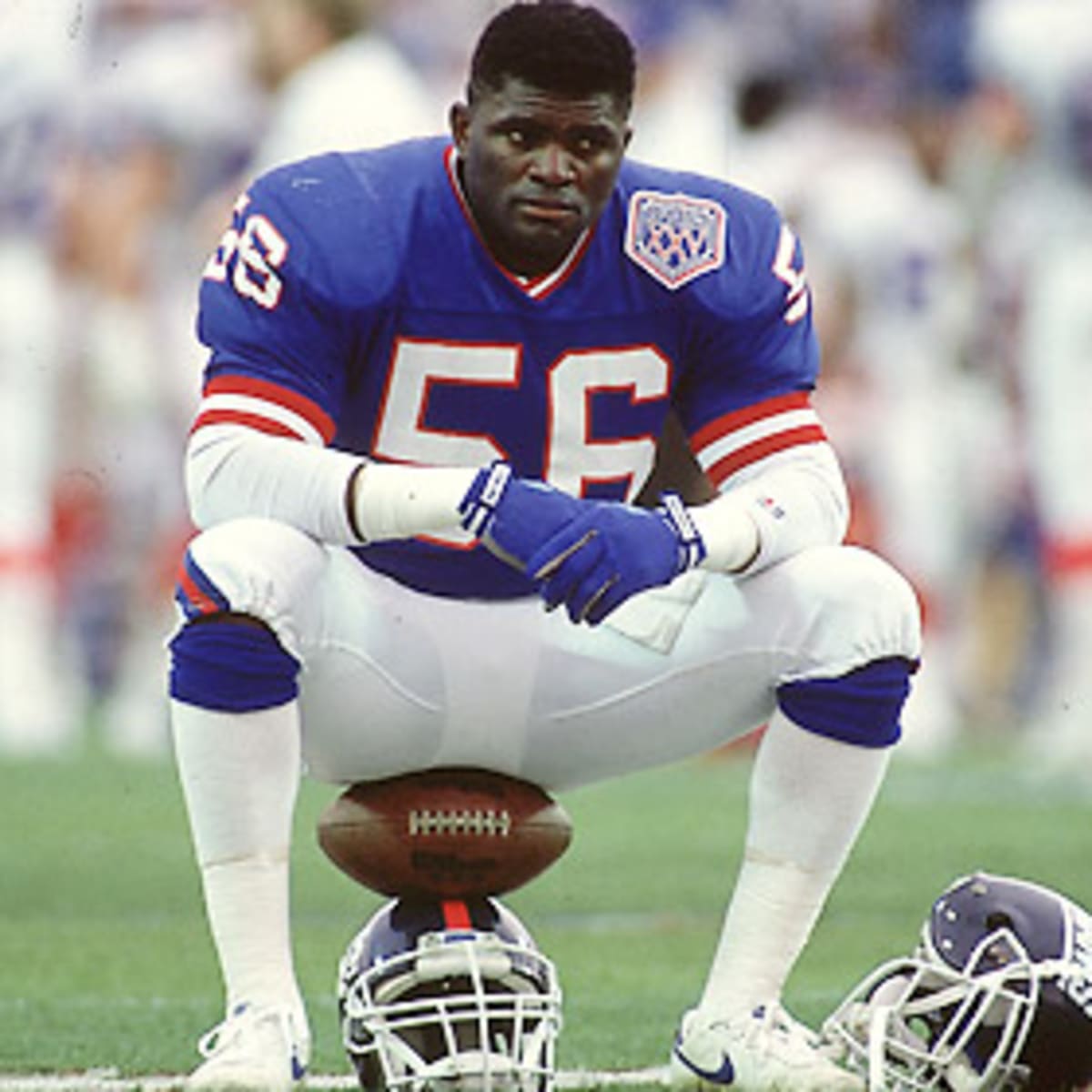 lawrence taylor sitting on helmet