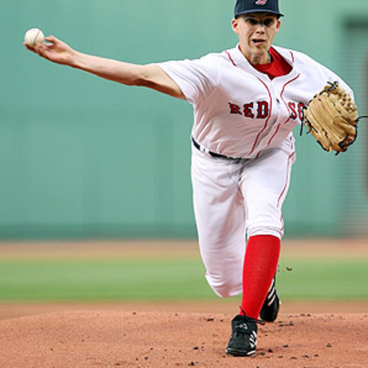 Mike Lowell of the Boston Red Sox swings at a pitch during the