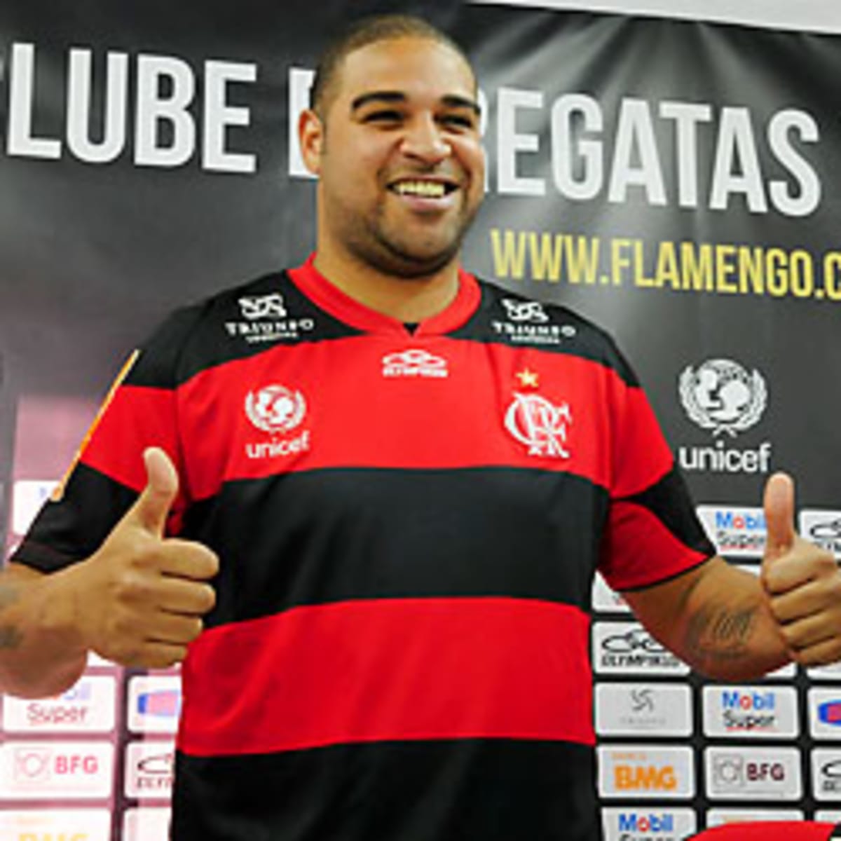 Brazilian soccer player Adriano holds up a Flamengo's jersey during a press  conference in Rio de Janeiro, Thursday, May 7, 2009. Adriano was officially  introduced by Flamengo, saying he regained his happiness