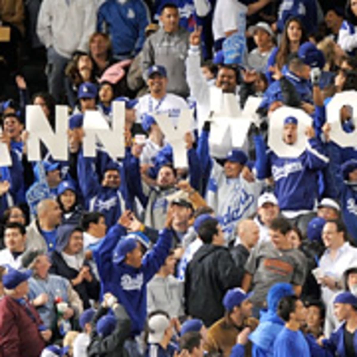 A fan holds up a jersey for Los Angeles Dodgers' Manny Ramirez