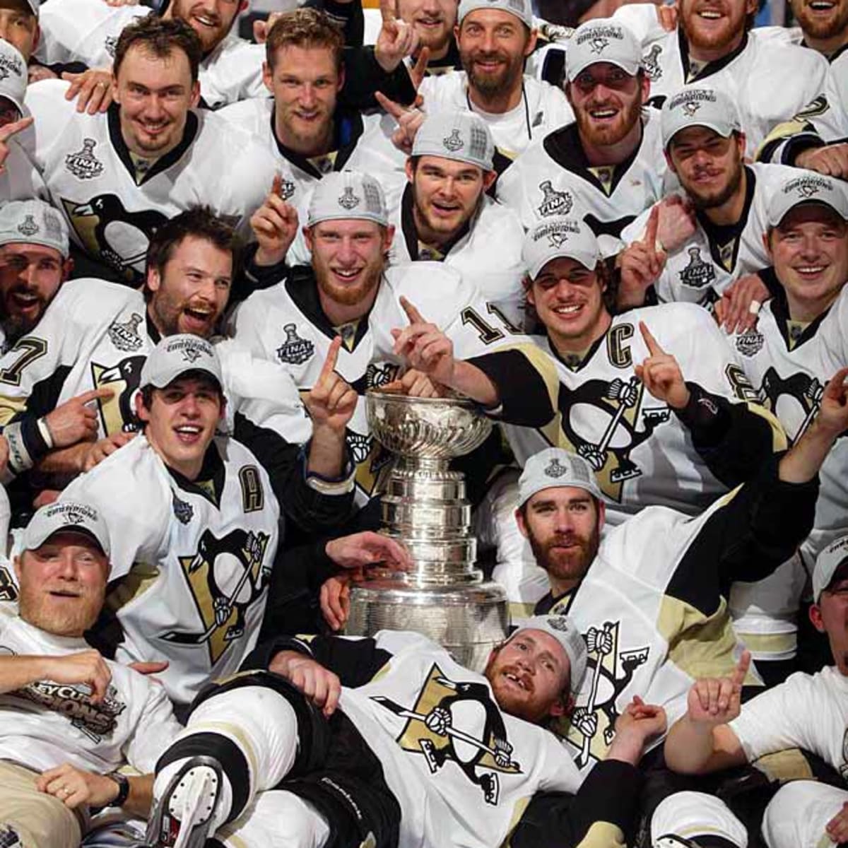 Pittsburgh Penguins' Petr Sykora skates with the Stanley Cup after