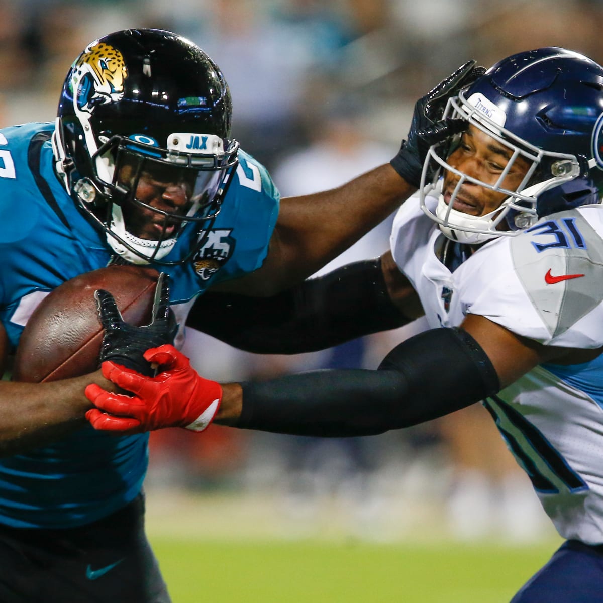 Jacksonville Jaguars running back Leonard Fournettte (27) celebrates 4-yard  touchdown run against the New England Patriots in the second quarter of the  AFC Championship game at Gillette Stadium in Foxborough, Massachusetts on