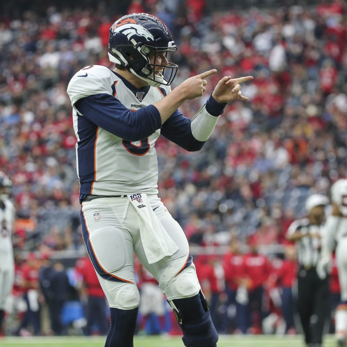 Drew Lock of the Denver Broncos carries the ball ahead of Derrick