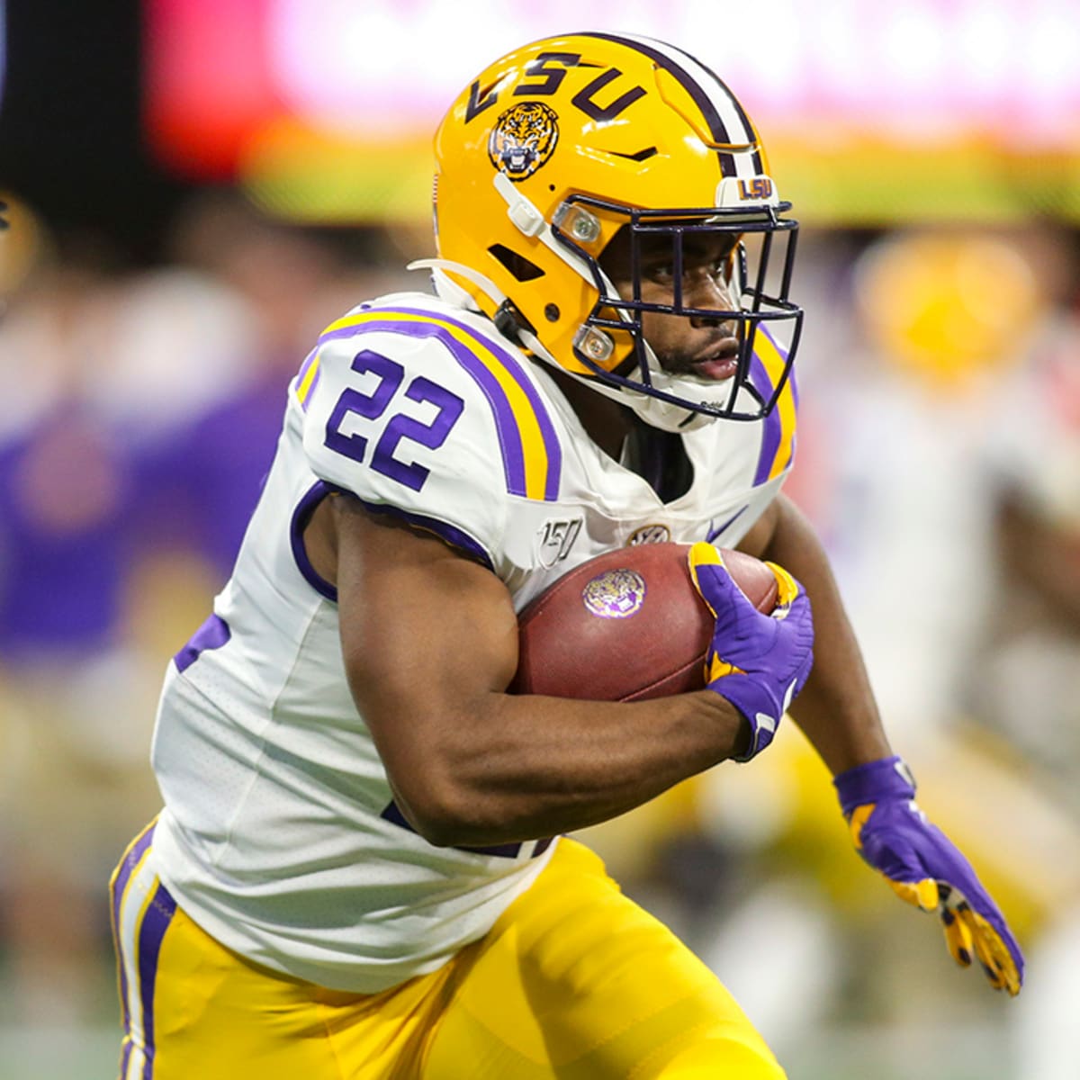 Clyde Edwards-Helaire LSU Tigers Unsigned White Jersey Rushing With Ball  vs. Auburn Photograph