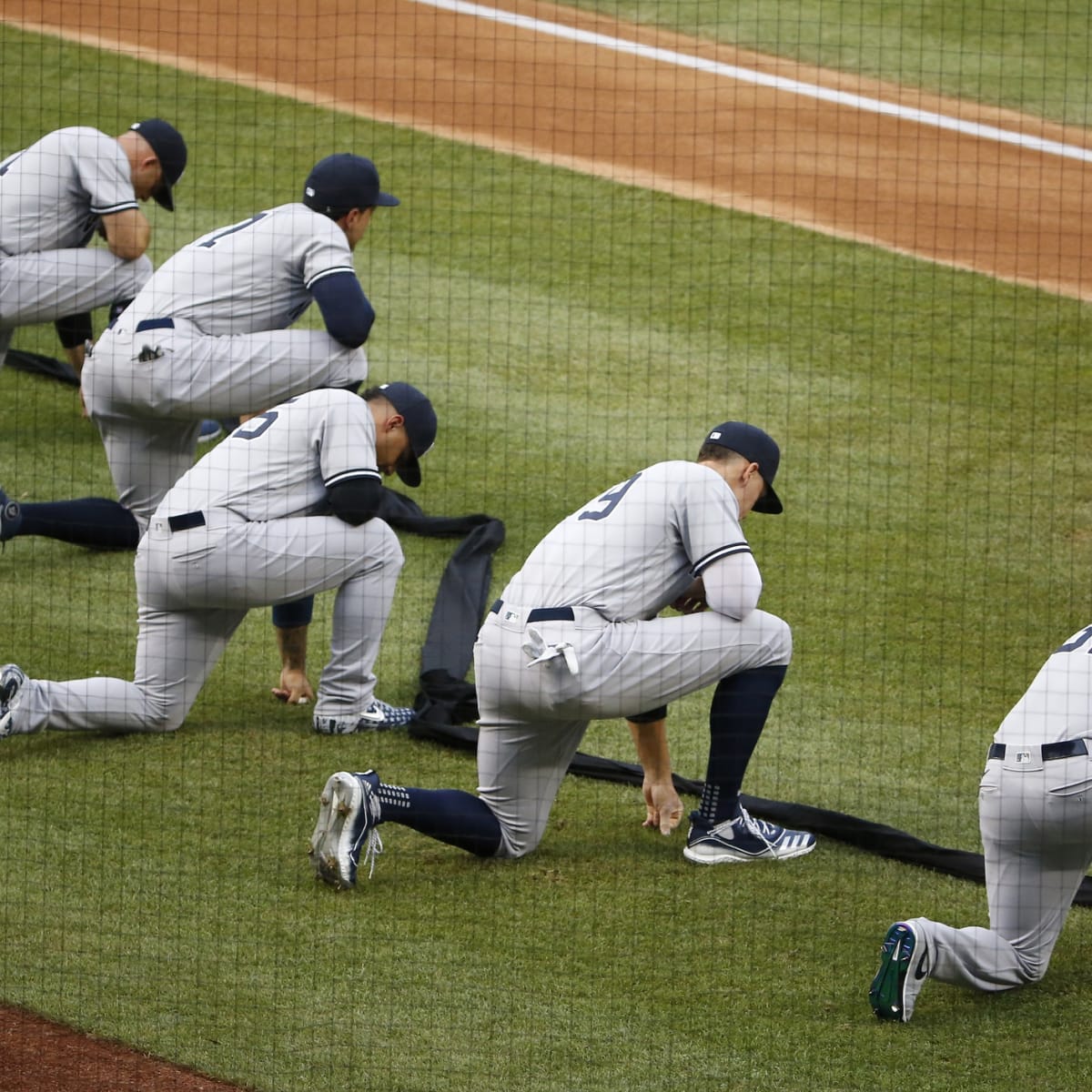 Yankees in 1912 Uniforms stand for the National Anthem