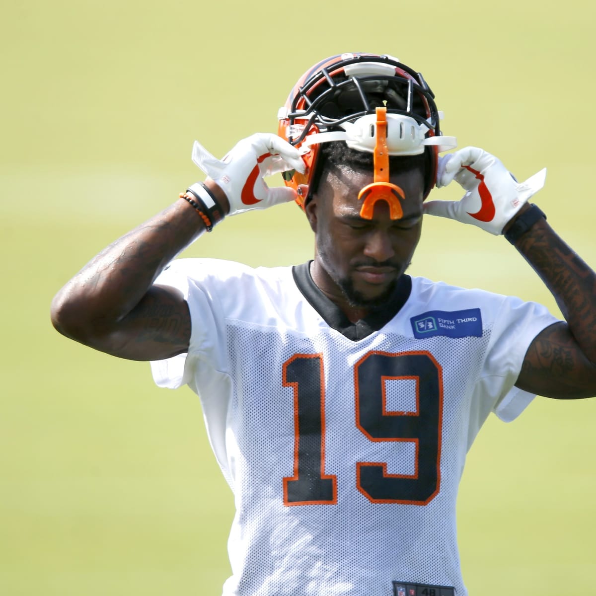 The Cincinnati Bengals look on as Bengals wide receiver Auden Tate is  carried off the field aft …