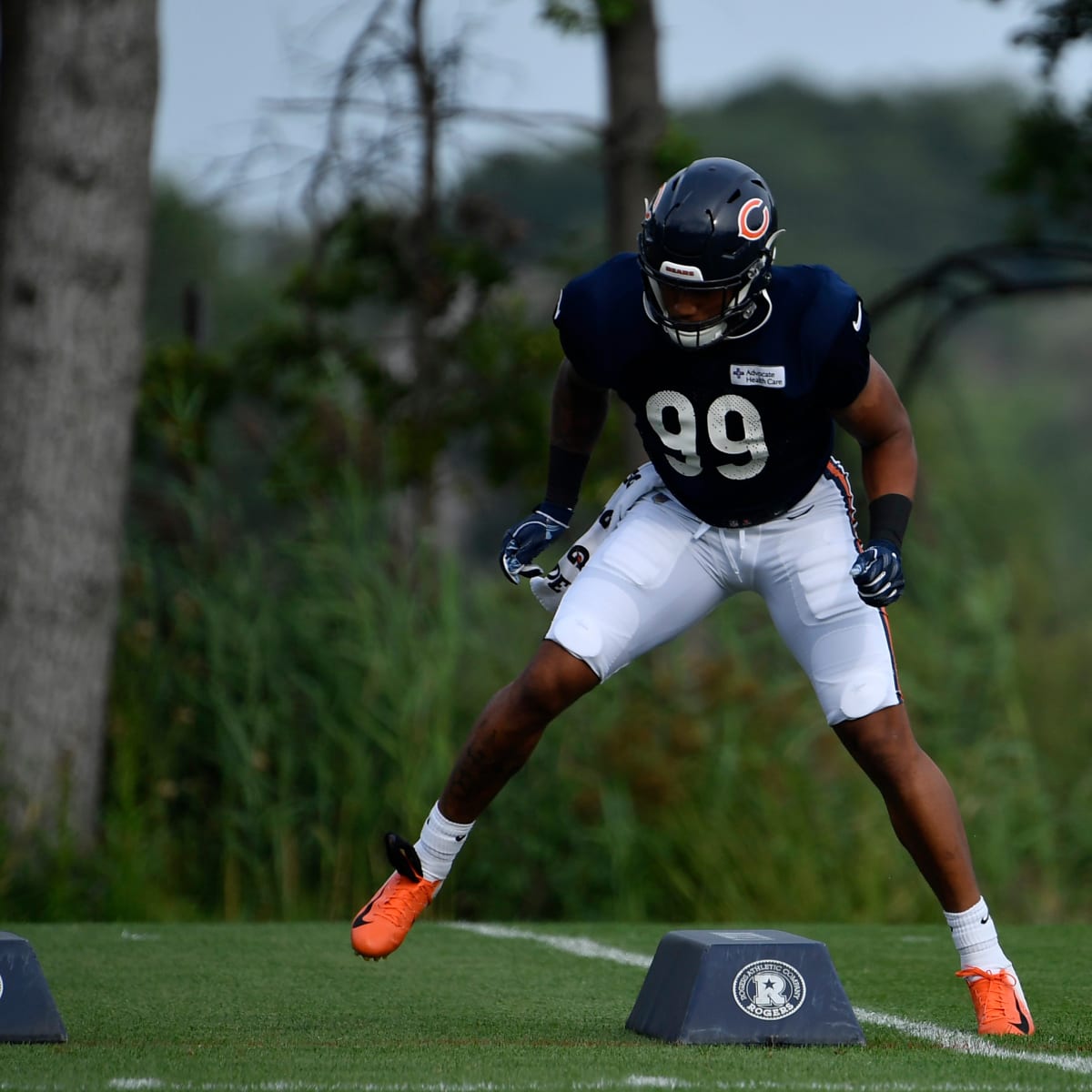 Chicago Bears defensive end Trevis Gipson (99) runs off the field