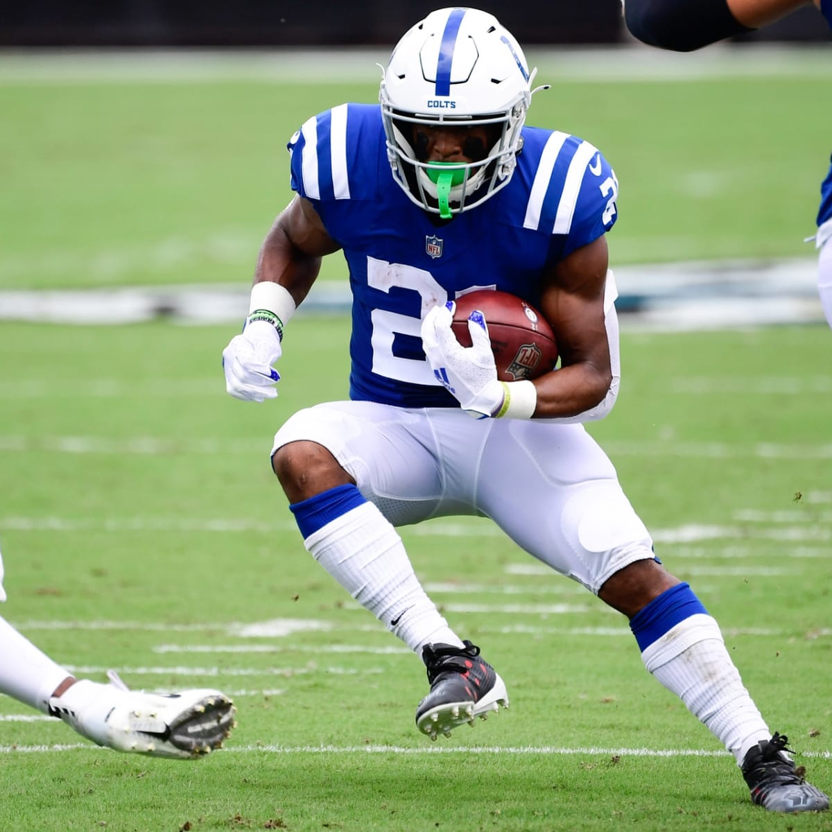 Indianapolis Colts running back Jordan Wilkins (20) runs the ball against  the Tennessee Titans …