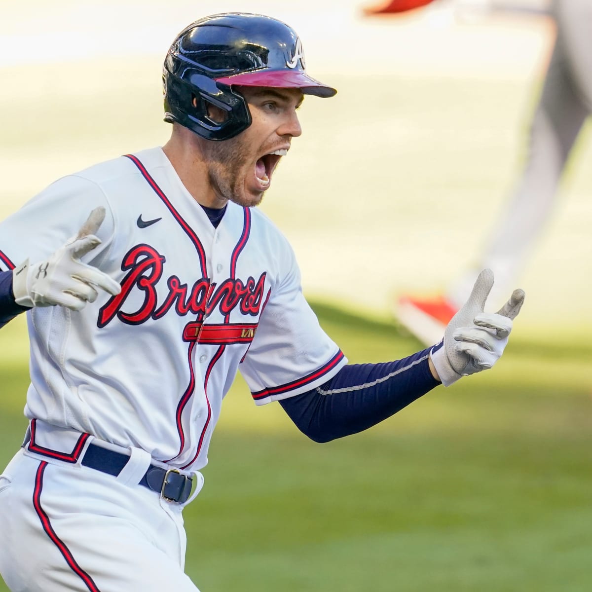 Atlanta Braves first baseman Freddie Freeman and New York Yankees  outfielder Aaron Judge share a laugh at first base after Judge hit a single  during the first inning of a MLB baseball