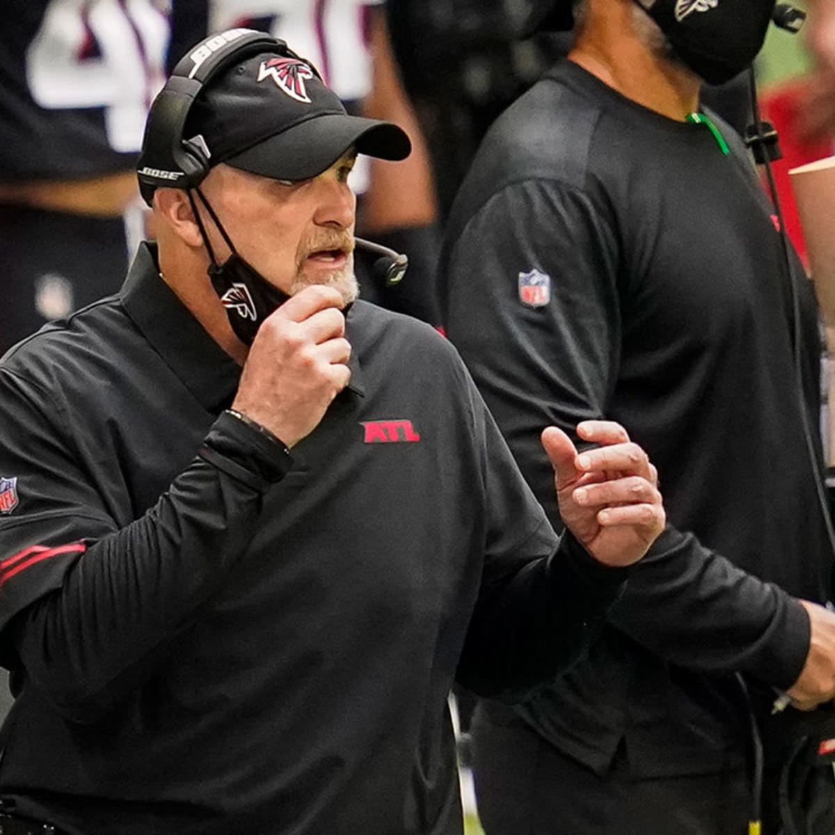 Falcons players standing by Dan Quinn after another gut-wrenching loss