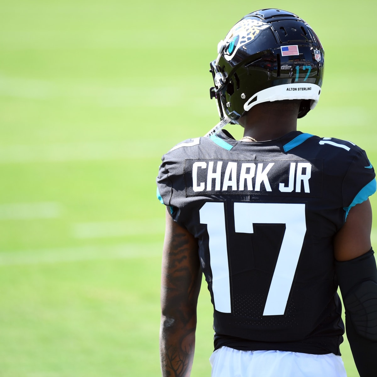 Jacksonville Jaguars wide receiver D.J. Chark (17) autographs his jersey on  the field after an NFL football game against the Tennessee Titans Sunday,  Sept. 23, 2018, in Jacksonville, Fla. The Titans won