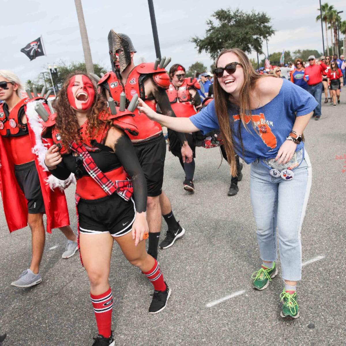 Fans tailgate in one of the parking lots near TIAA Bank Field