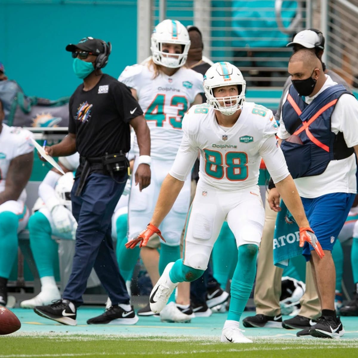 Miami Dolphins tight end Mike Gesicki (88) urges the fans to get