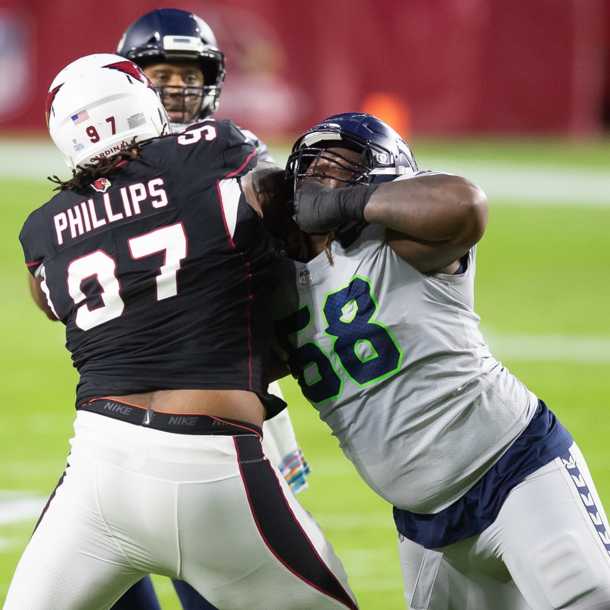 Seattle Seahawks guard Damien Lewis, left, celebrates with head coach Pete  Carroll after the team scored during the first half of an NFL football game  against the Arizona Cardinals in Glendale, Ariz.