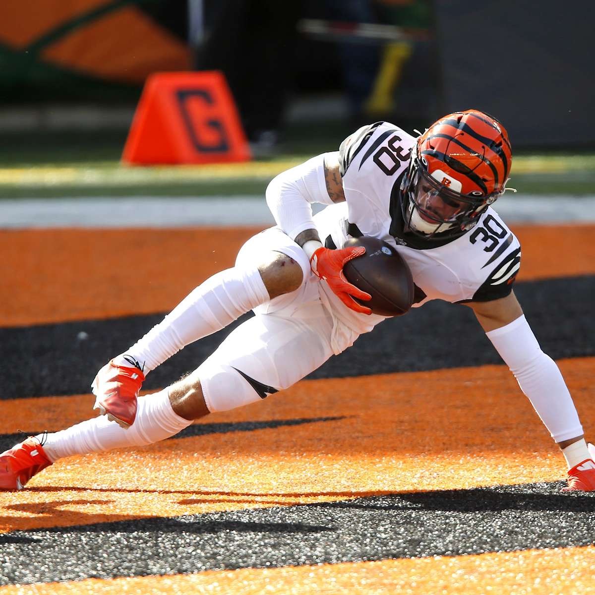 Cincinnati Bengals free safety Jessie Bates (30) and Mike Hilton celebrate  after breaking up a pass during the first half of an NFL football game  against the Kansas City Chiefs, Sunday, Jan.