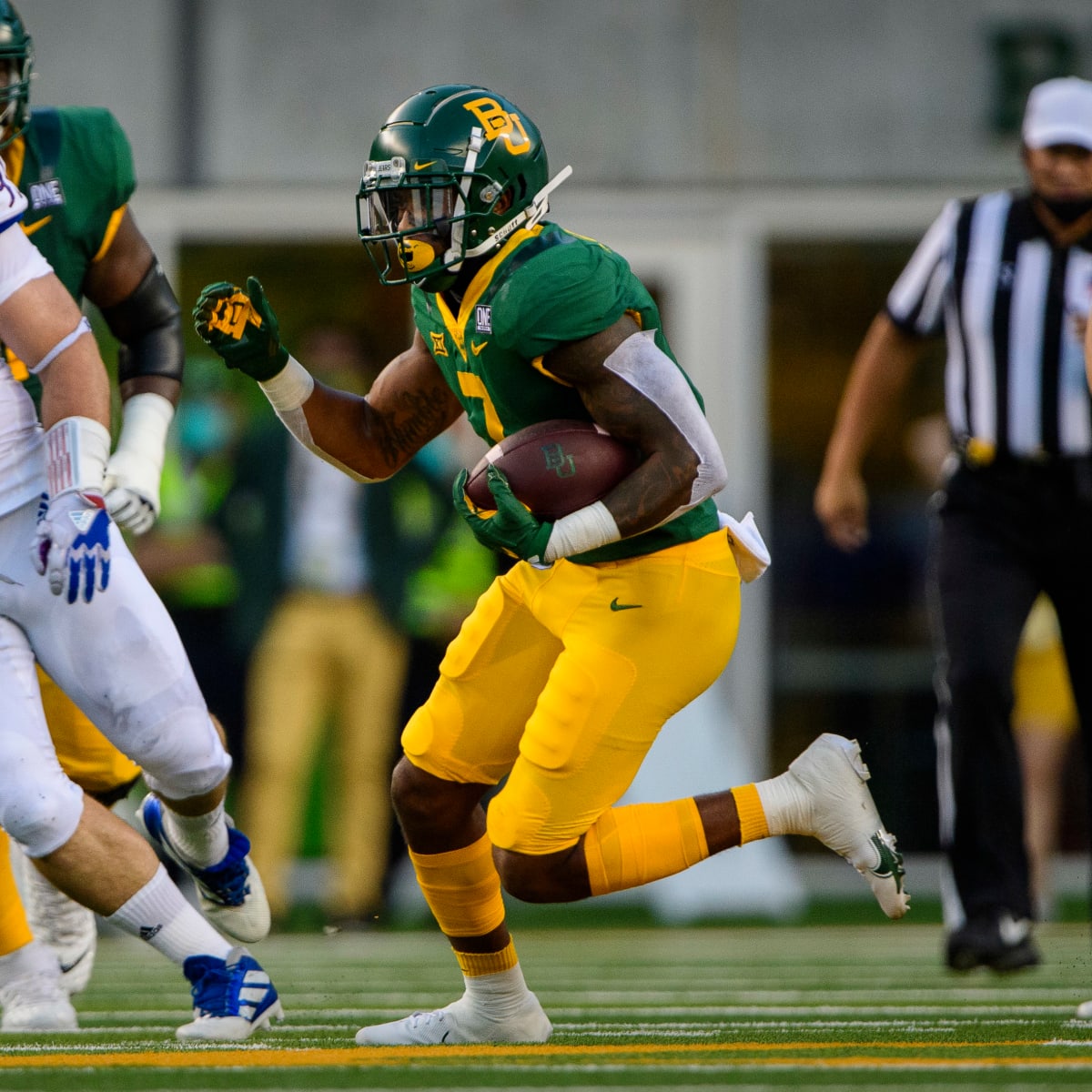 Carolina Panthers running back John Lovett runs against the