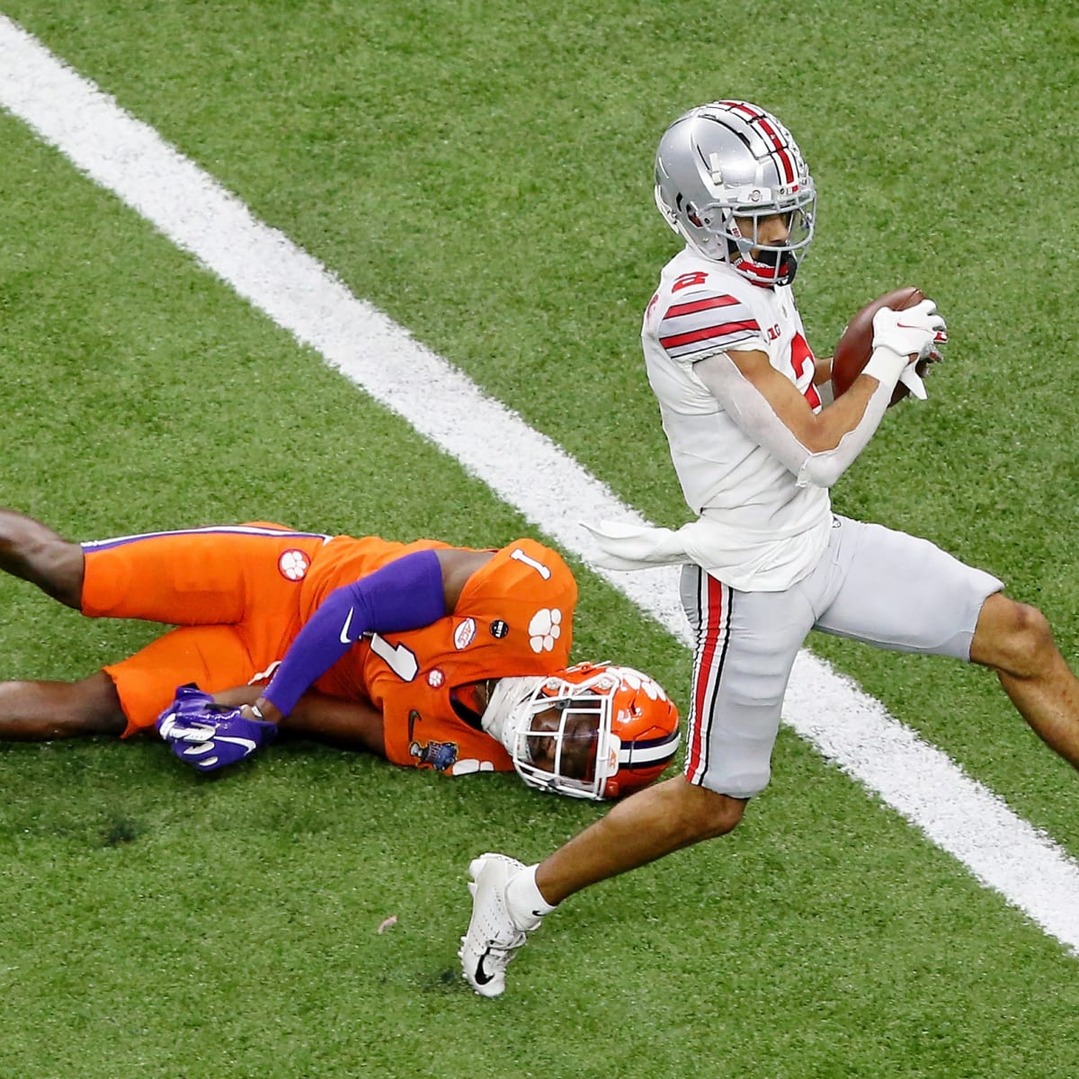 Ohio State football's Chris Olave, Haskell Garrett voted preseason