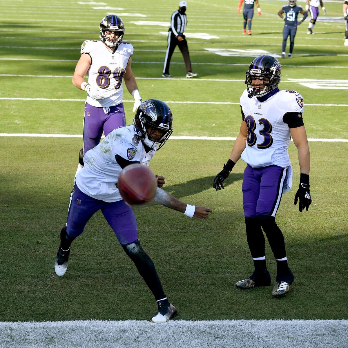 Lamar Jackson wins first playoff game as Ravens edge Titans - Sports  Illustrated