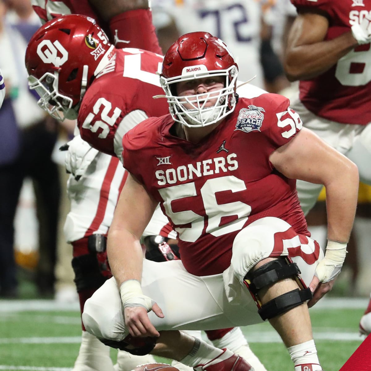 Kansas City Chiefs center Creed Humphrey (52) gets set on the line