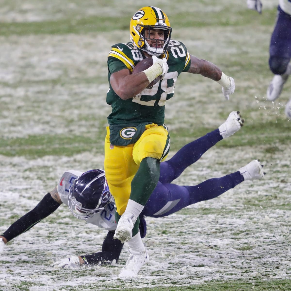 A.J. Dillon of the Green Bay Packers runs before a game against the