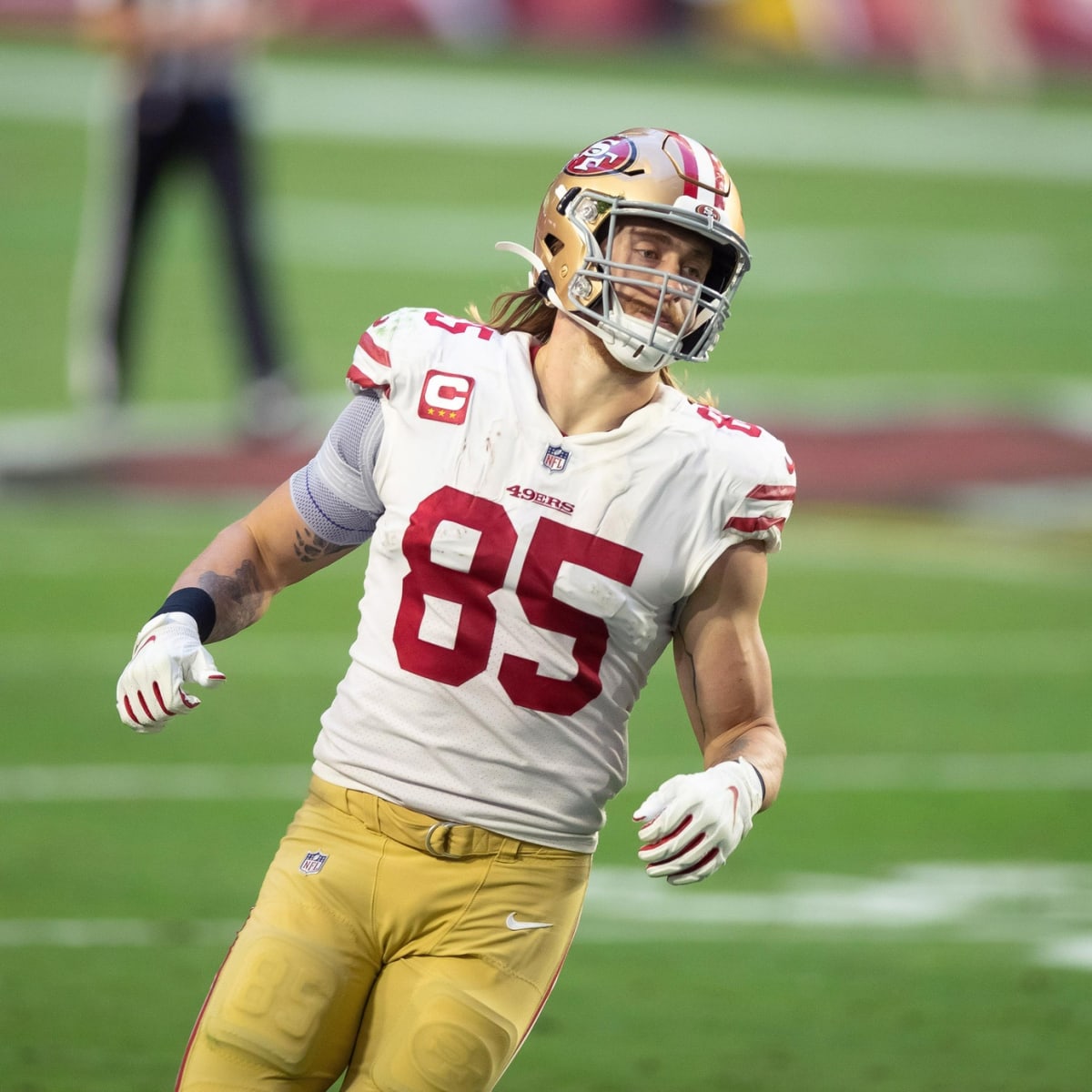 San Francisco 49ers first-round pick Nick Bosa, center, holds up a jersey  next to his mother Cheryl, left, and father John during an NFL football  news conference, Friday, April 26, 2019, in