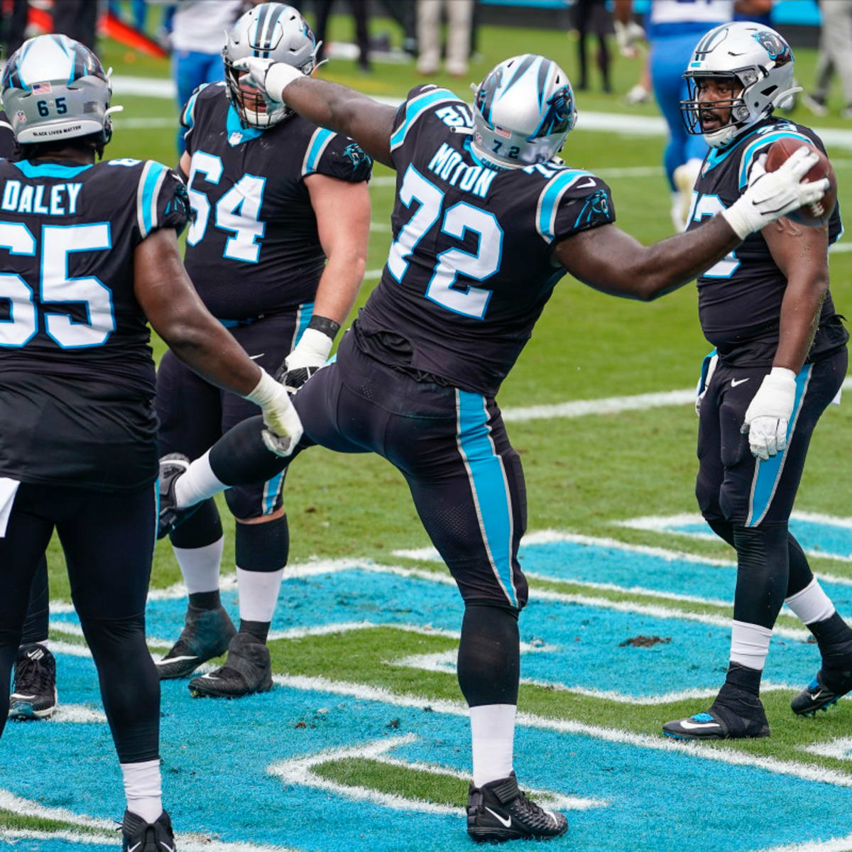 Carolina Panthers offensive tackle Taylor Moton (72) runs off the