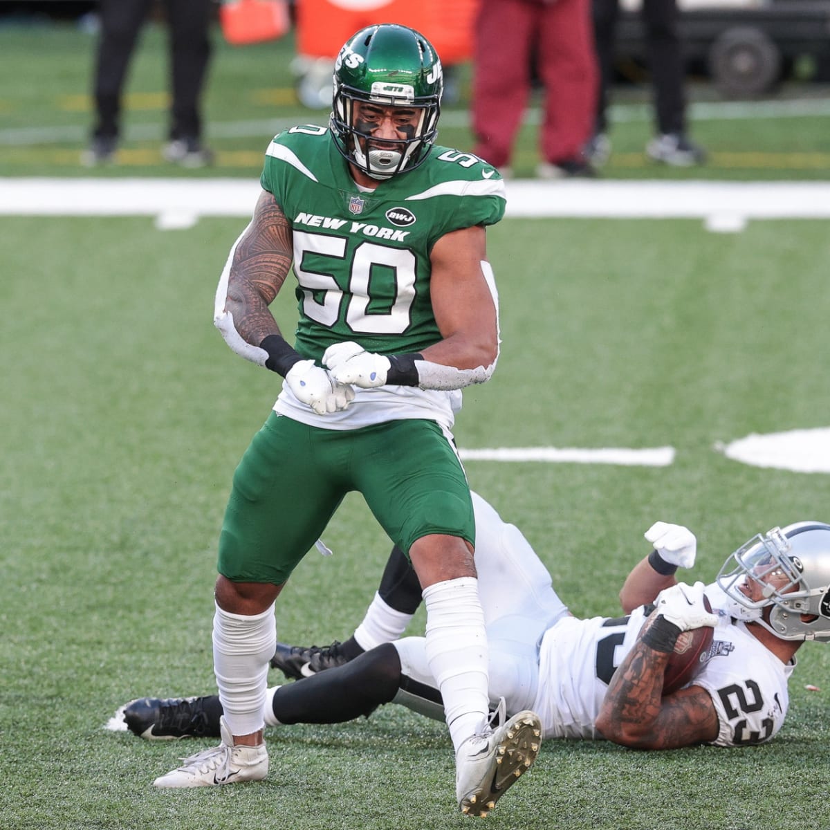 New York Jets linebacker Frankie Luvu (50) and strong safety Jamal