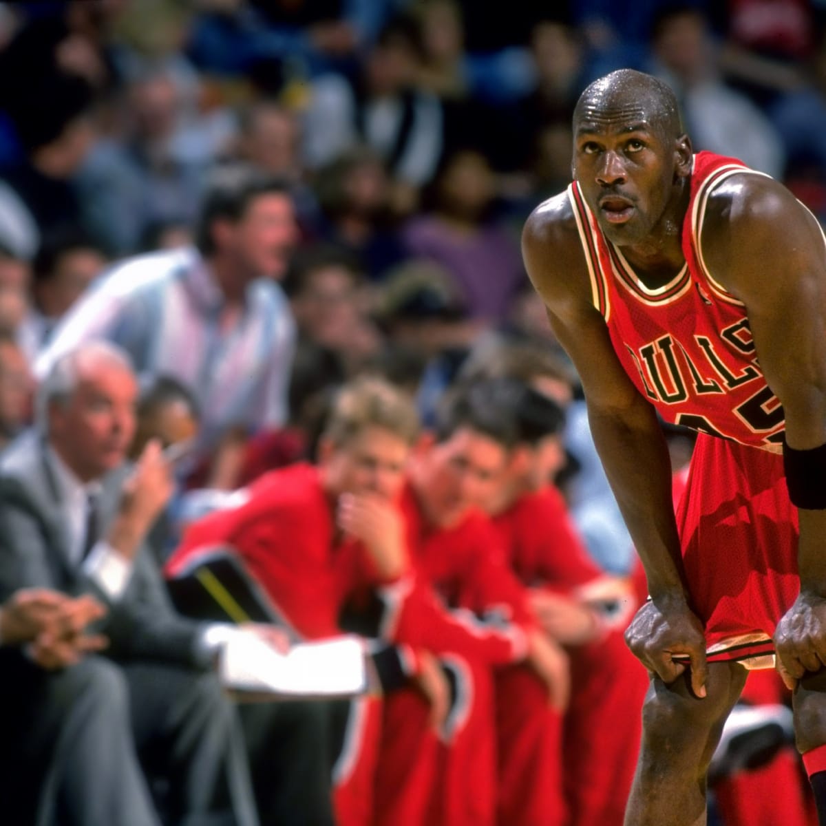 CHICAGO, UNITED STATES: With a bandage on his finger and a smile on his  face, Michael Jordan of the Chicago Bulls announces his retirement from the  NBA after 13 seasons, during a