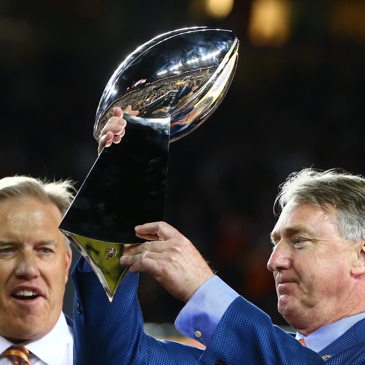 Photo: The Bowlen family with the bust of Pat Bowlen at the Pro