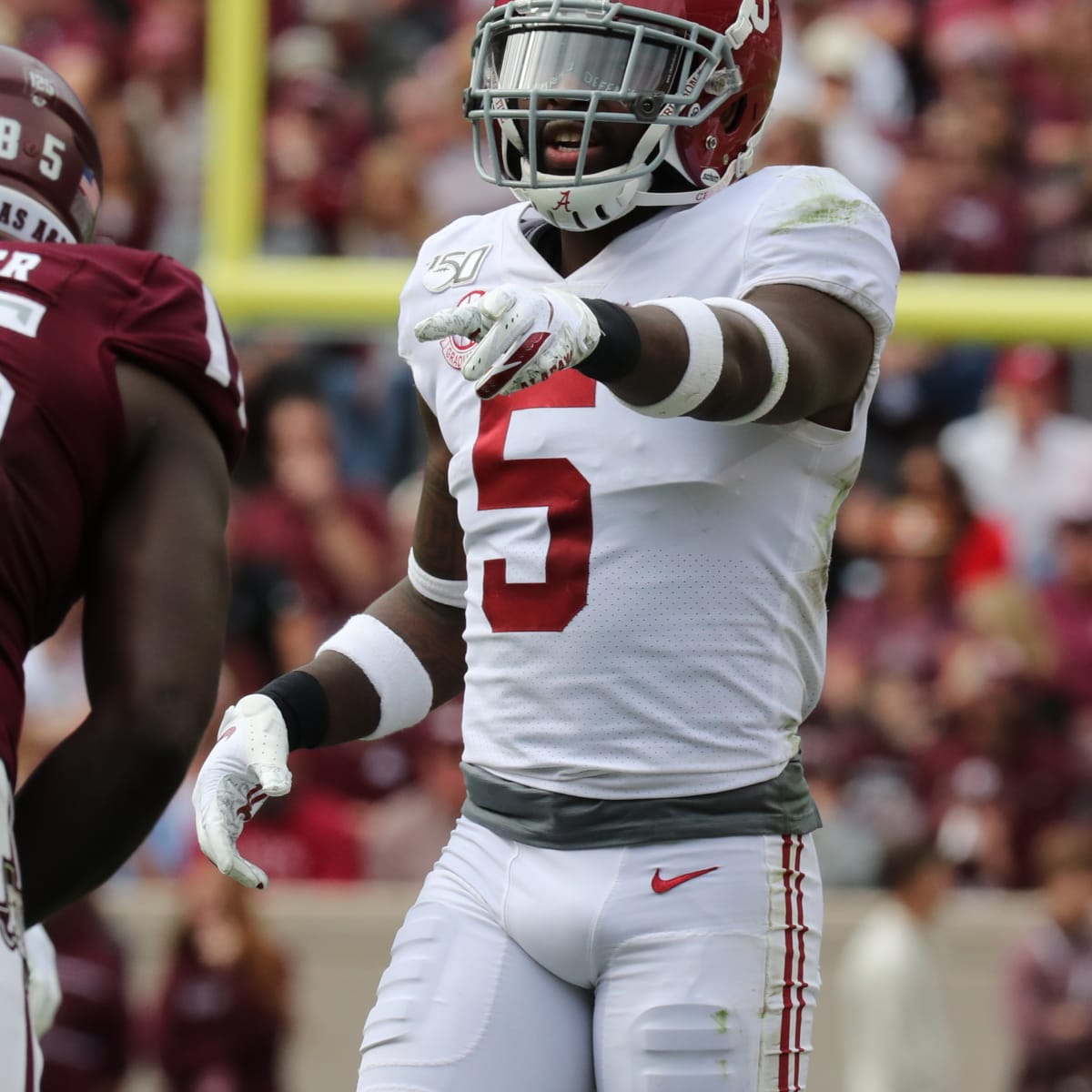 Alabama defensive back Shyheim Carter (5) stops Texas A&M running