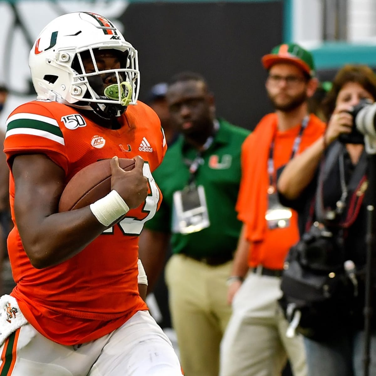 DeeJay Dallas of the Seattle Seahawks gestures to the fans during