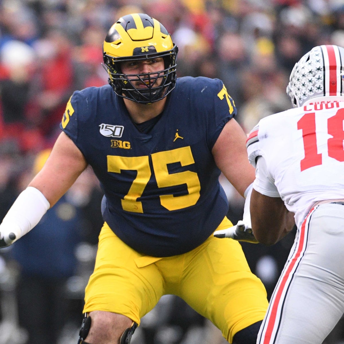 Michigan's Runyan feels pressure of family history