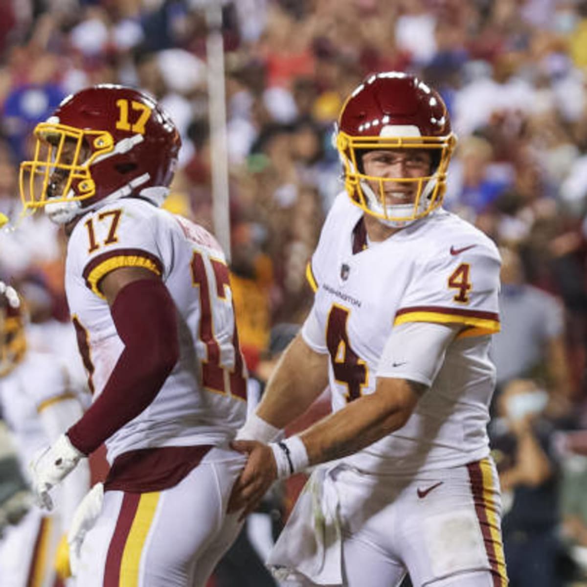 Washington Football Team's Taylor Heinicke scores with a beer