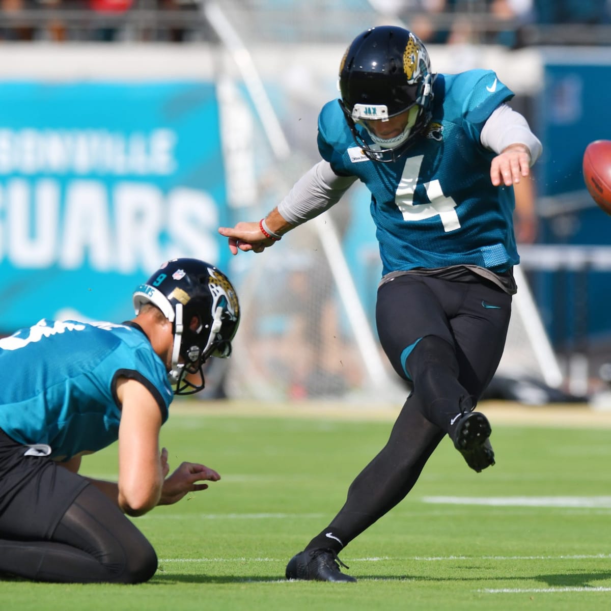 Jacksonville Jaguars kicker Josh Lambo, right, kicks a field goal in the  first half of an NFL football game against the Cincinnati Bengals, Sunday,  Oct. 20, 2019, in Cincinnati. (AP Photo/Frank Victores