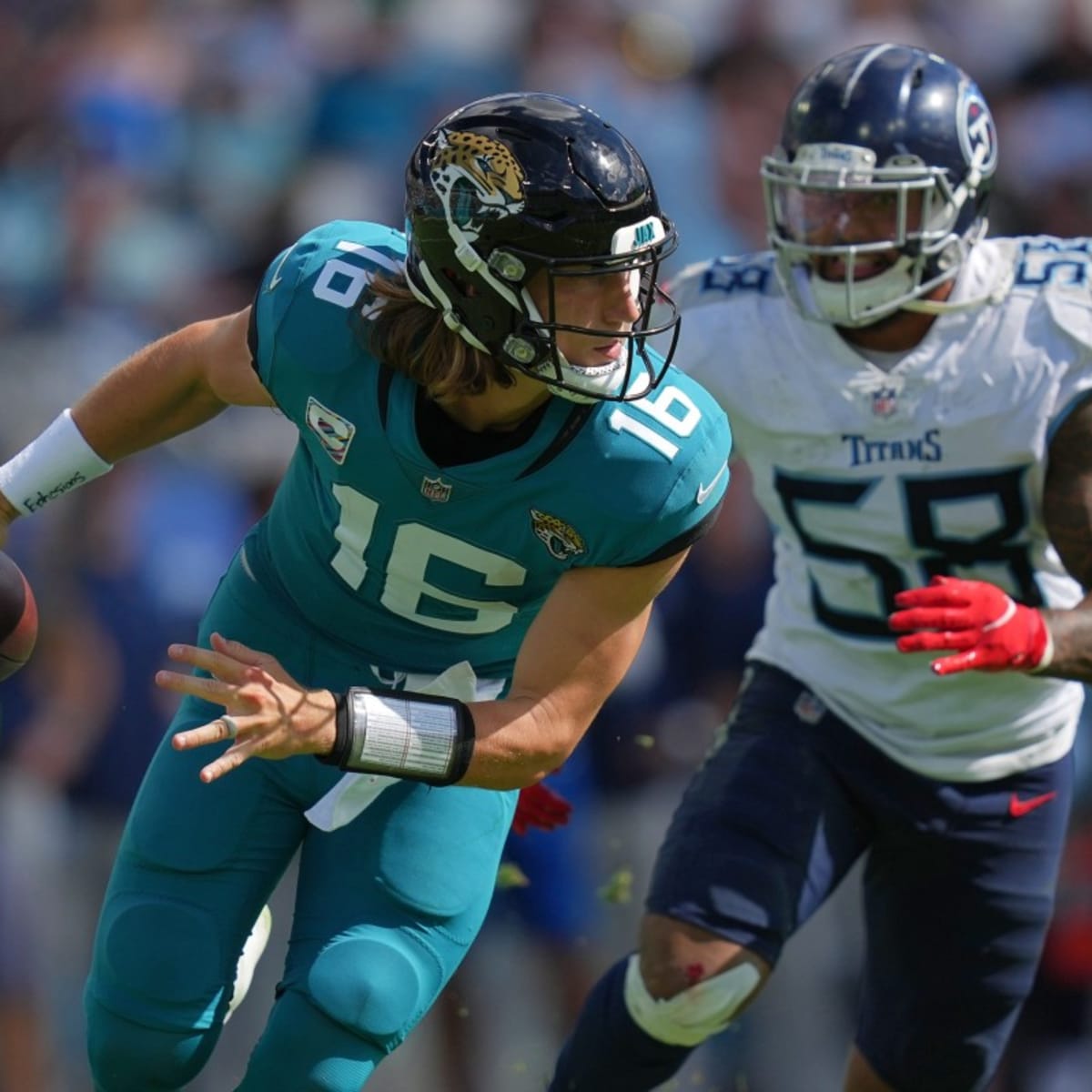 Jacksonville Jaguars quarterback Trevor Lawrence (16) prepares to