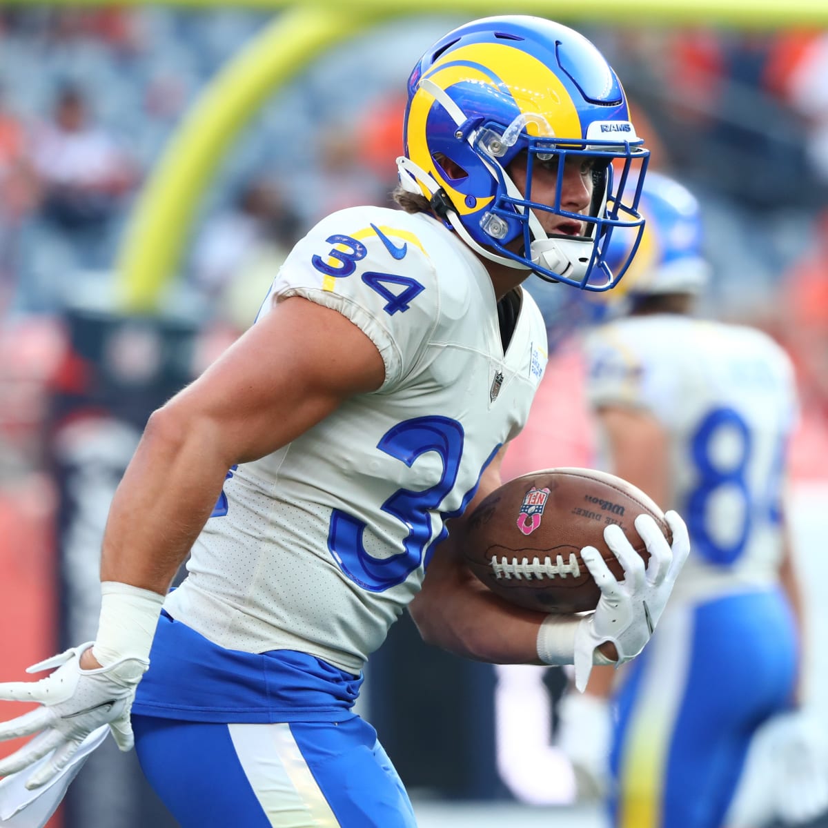 Los Angeles Rams running back Jake Funk (34) runs with the ball during an  NFL football game against the Houston Texans Friday, Aug. 19, 2022, in  Inglewood, Calif. (AP Photo/Kyusung Gong Stock