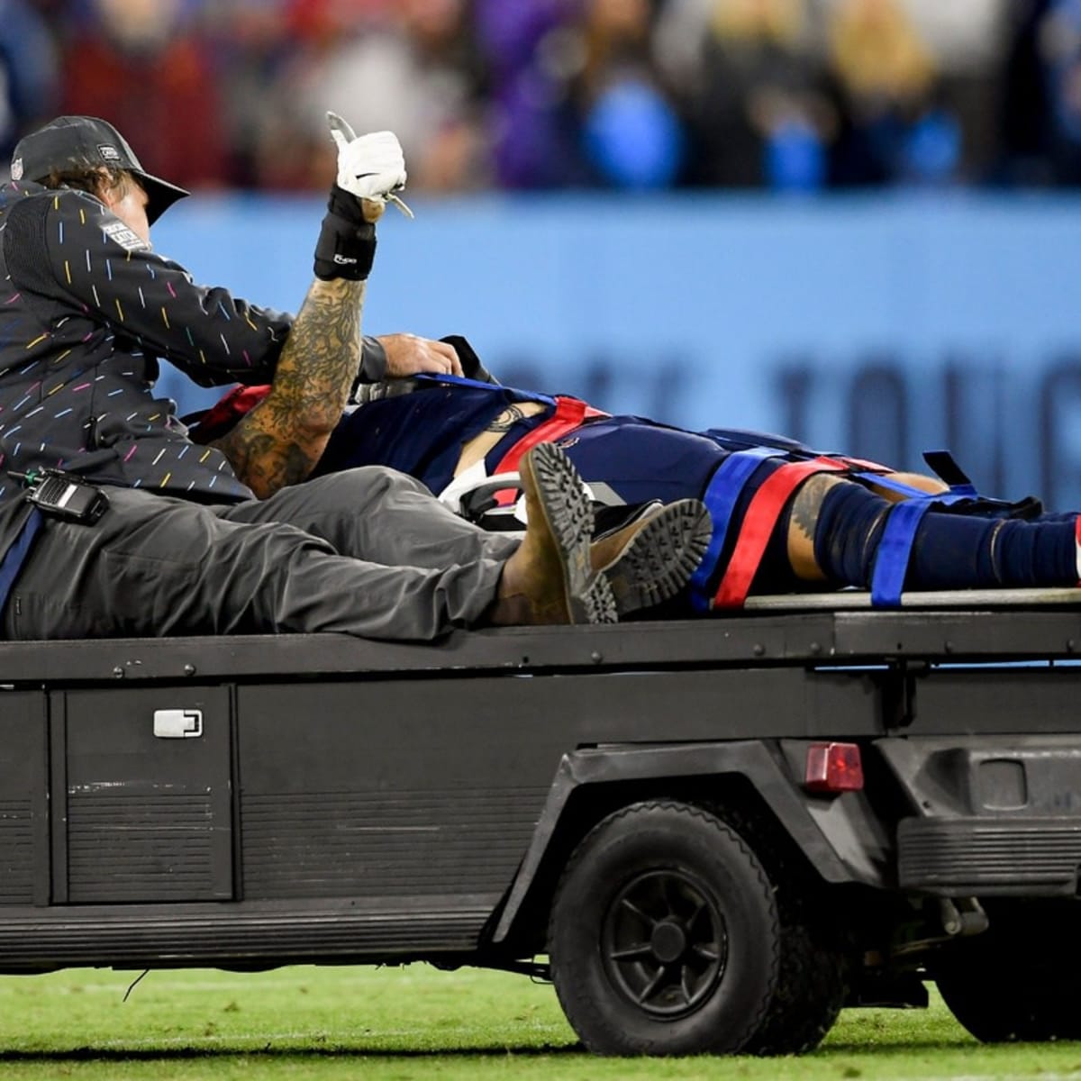 Tennessee Titans offensive tackle Taylor Lewan gives the thumbs up sign as  he is taken off the field after being injured against the Buffalo Bills in  the first half of an NFL