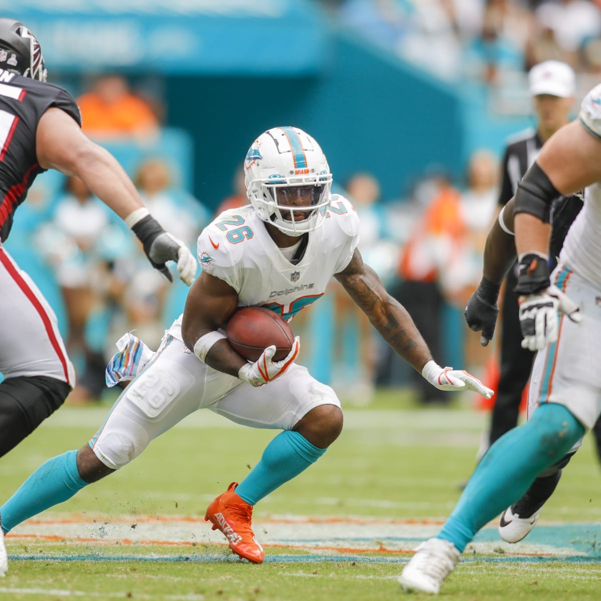 Running back Salvon Ahmed of the Miami Dolphins runs against the Las