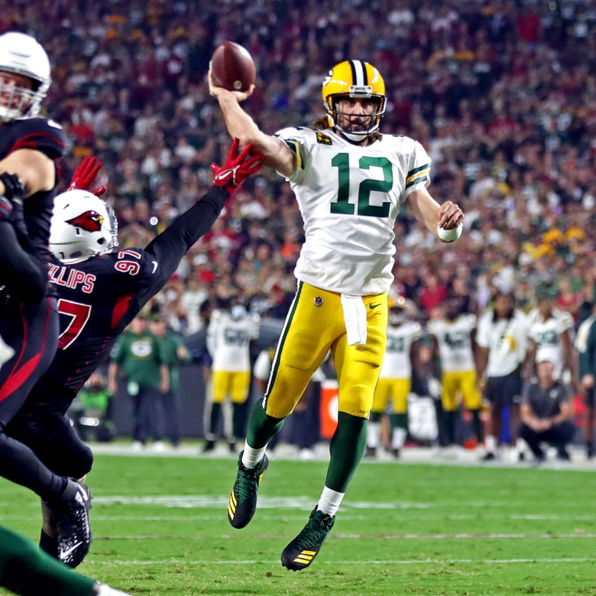 Green Bay Packers quarterback Aaron Rodgers (12) reaches over the goal line  for a touchdown during an NFL football game against the Los Angeles Chargers,  Sunday, November 3, 2019 in Carson, Calif.